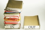 Close-up of empty out box and full in box